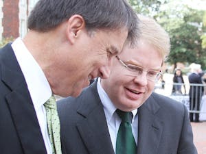 	Gubernatorial candidate Pat McCrory (left) and Peter Hans, UNC BOG Chairman, converse after Bill Friday’s memorial on Oct. 17.