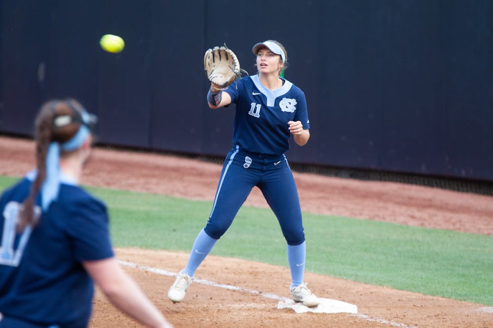 UNC junior infielder Katie Perkins (11) catches the ball at first base to get a runner out during a home game against N.C. Central at Anderson Stadium on Wednesday, Apr. 20, 2022.