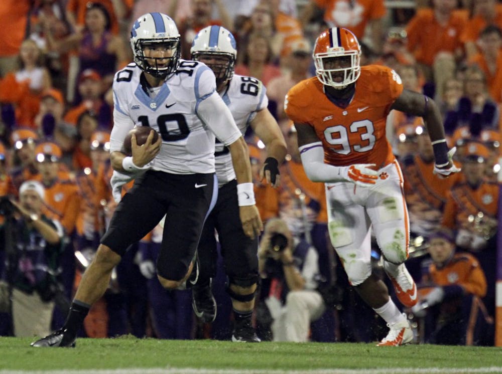 UNC's Mitch Trubisky (10) runs the ball up the middle of the field during the UNC - Clemson game September, 20 . Trubisky rushed for 13 yards.