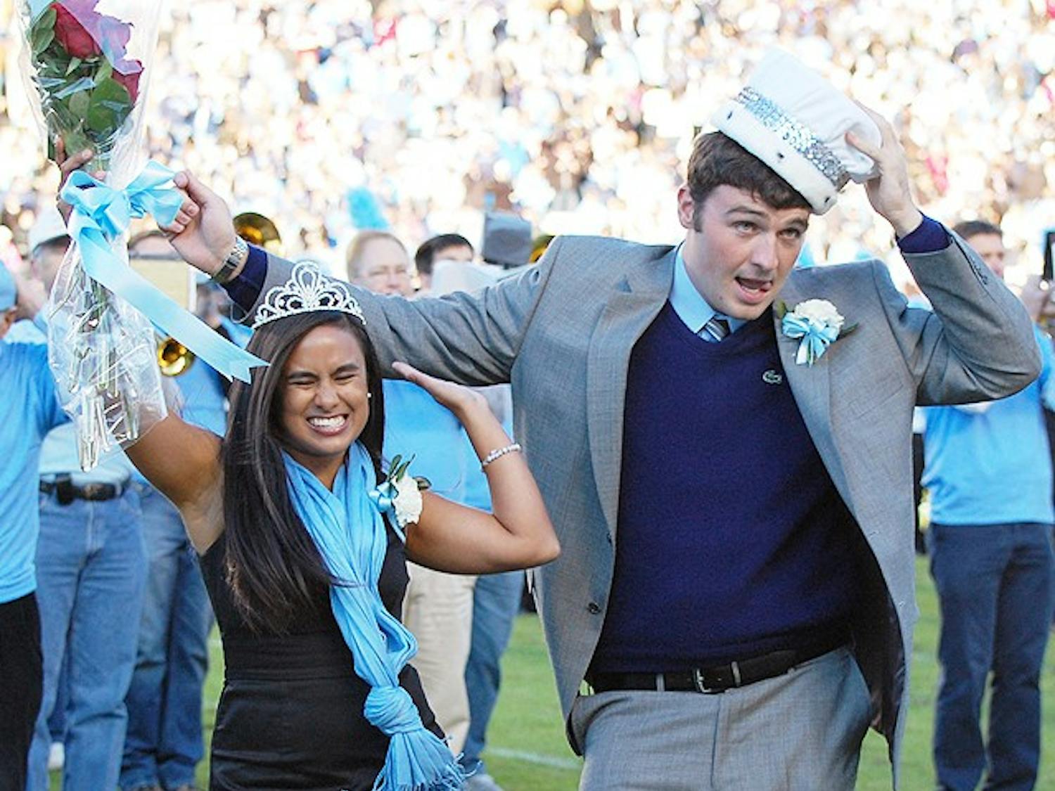 UNC football homecoming game vs. Wake Forest. Holly Roberts, english and pyschology major, and Clint Hannah, journalism and sports administration major, celebrate their victory as mr. and miss. UNC