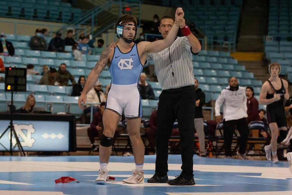 Redshirt-senior Austin O'Connor is victorious after defeating Little Rock's Austin Keal on Sunday, Jan. 23, 2022, at Carmicheal Arena. O'Connor beat Keal, 24-9.