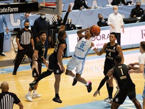 UNC first-year guard Caleb Love (2) goes up for a layup in Carolina's 78-70 victory over Florida State in the Smith Center, Feb. 27, 2021.