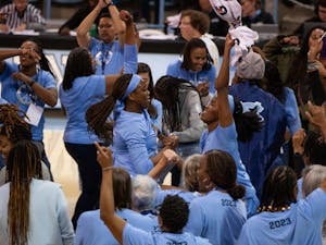 Current and past players of the UNC women’s basketball program celebrate together at the game against the N.C. State Wolfpack in Carmichael Arena on Sunday, Jan. 15, 2022. The Tar Heels won 56-47.