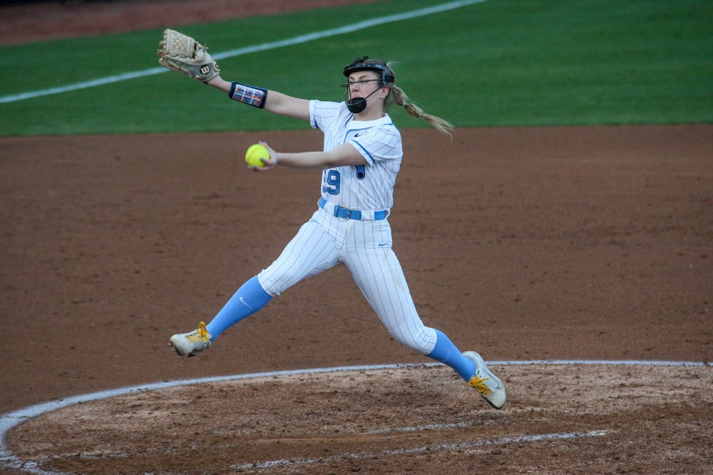 <p>Sophomore pitcher Lilli Backes (99) pitches the ball at a game against the University of Michigan on Tuesday, Mar. 1, 2022. The Tar Heels lost 0-8.</p>
