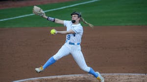 Sophomore pitcher Lilli Backes (99) pitches the ball at a game against the University of Michigan on Tuesday, Mar. 1, 2022. The Tar Heels lost 0-8.
