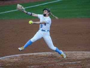 First-year pitcher Lilli Backes (99) pitches the ball at a game against the University of Michigan on Tuesday, Mar. 1, 2022. The Tar Heels lost 0-8.