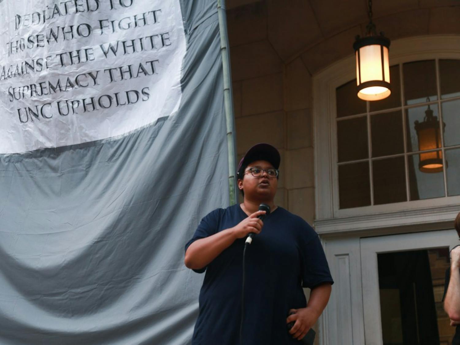 UNC graduate student Maya Little speaks to the crowd of protestors at Peace and Justice Plaza on Franklin St. 