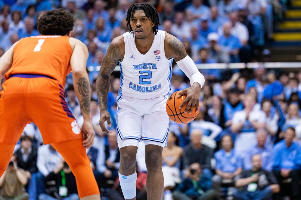 <p>UNC junior guard Caleb Love (2) dribbles the ball up the court during the men’s basketball game against Clemson on Saturday, Feb. 11, 2023 at the Dean E. Smith Center.</p>