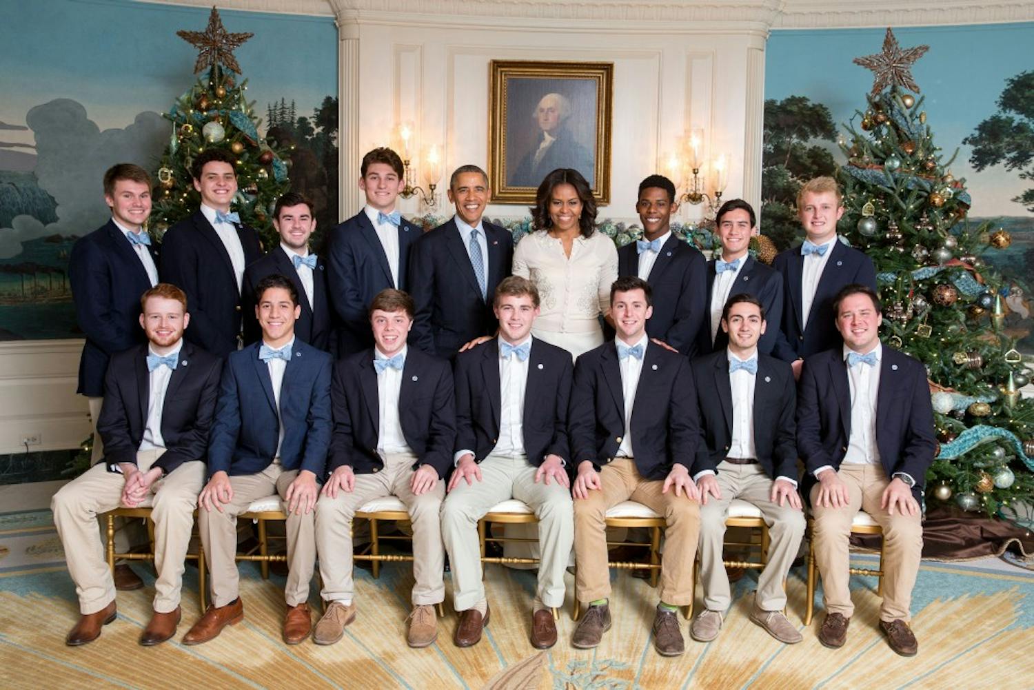 President Barack Obama and First Lady Michelle Obama join the UNC (University of North Carolina) Clef Hangers for a group photo and listen to them perform in the Diplomatic Reception Room prior to Christmas holiday EOP Reception #1 at the White House, Dec. 15, 2015. (Official White House Photo by Chuck Kennedy)This photograph is provided by THE WHITE HOUSE as a courtesy and may be printed by the subject(s) in the photograph for personal use only. The photograph may not be manipulated in any way and may not otherwise be reproduced, disseminated or broadcast, without the written permission of the White House Photo Office. This photograph may not be used in any commercial or political materials, advertisements, emails, products, promotions that in any way suggests approval or endorsement of the President, the First Family, or the White House.