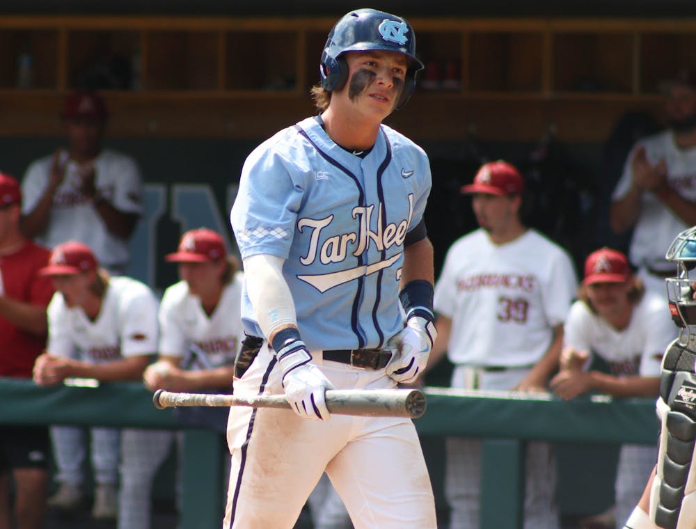 First-year center fielder Vance Honeycutt (7) looks into the stands after striking out. UNC lost 3-4 against Arkansas at home in the NCAA Super Regionals on Sunday, June 12, 2022.