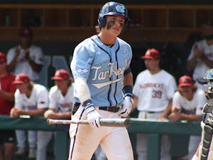 First-year center fielder Vance Honeycutt (7) looks into the stands after striking out. UNC lost 3-4 against Arkansas at home in the NCAA Super Regionals on Sunday, June 12, 2022.