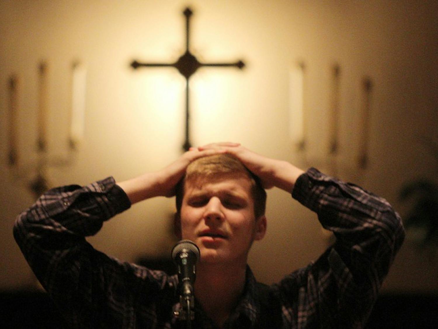 High school senior Colby Kanode plays worship music at the 24/7 prayer kick off on Thursday night. 