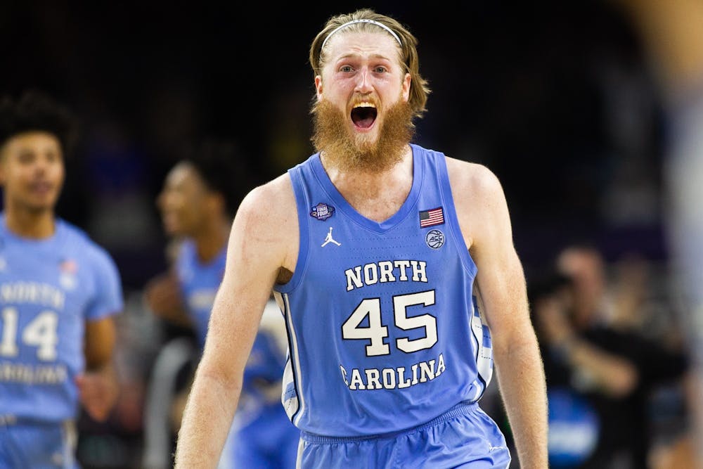 UNC graduate forward Brady Manek (45) celebrates victory after the Final Four of the NCAA Tournament against Duke in New Orleans on Saturday, April 2, 2022. UNC won 81-77.