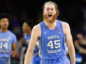 UNC graduate forward Brady Manek (45) celebrates victory after the Final Four of the NCAA Tournament against Duke in New Orleans on Saturday, April 2, 2022. UNC won 81-77.