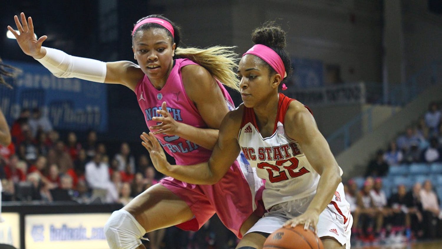 First-year guard Stephanie Watts (5) guards Dominique Wison&nbsp;(22)&nbsp;during the game against N.C. State.