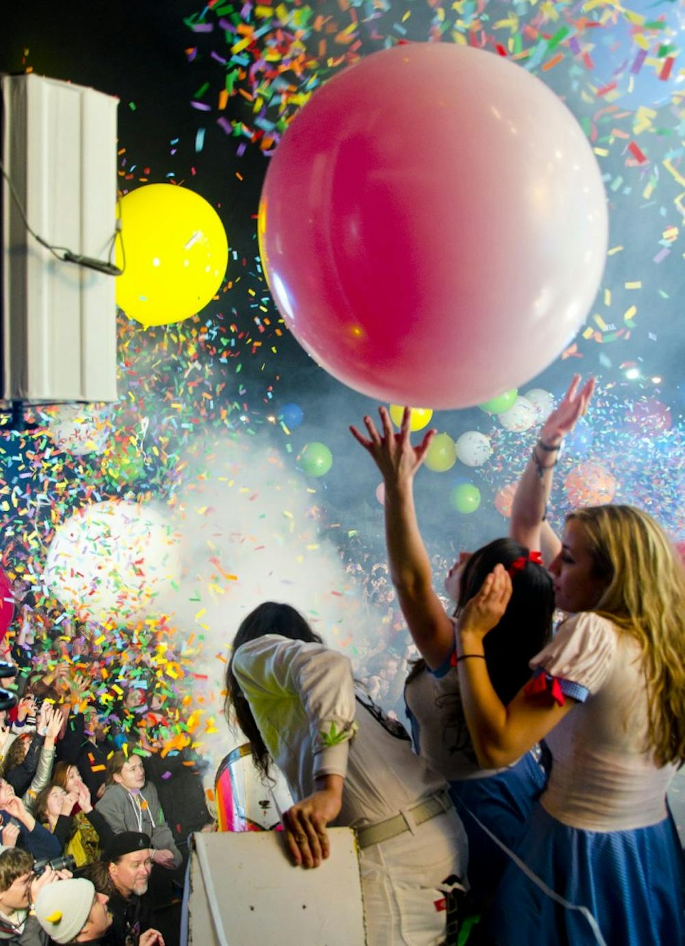 	<p>A member of the Flaming Lip&#8217;s production crew aims a confetti cannon above the crowd at Moogfest 2011. </p>