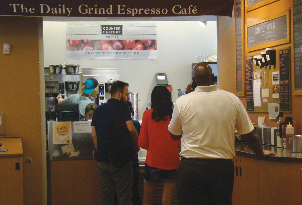 Senior Biology major, Emily Price, serves customers of The Daily Grind Espresso Cafe. The Daily Grind will likely be closed and replaced with the ownership of the UNC Student Stores transitioning to Barnes & Noble on July 1.