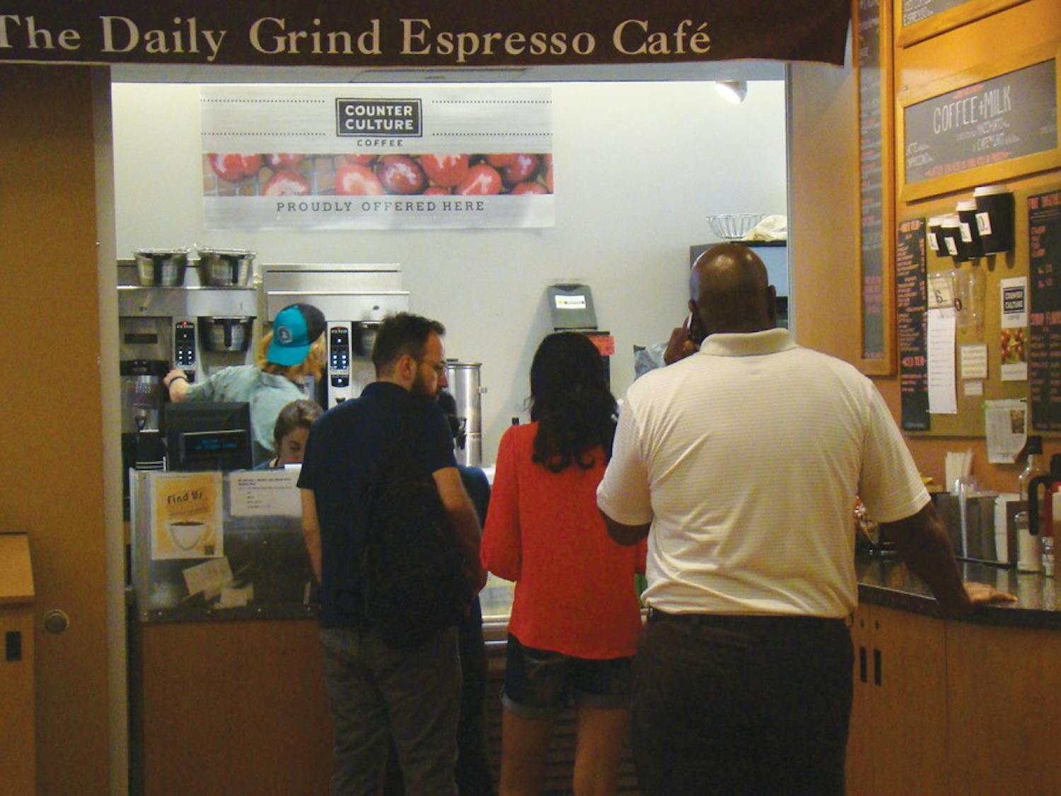 Senior Biology major, Emily Price, serves customers of The Daily Grind Espresso Cafe. The Daily Grind will likely be closed and replaced with the ownership of the UNC Student Stores transitioning to Barnes & Noble on July 1.