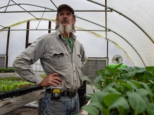 Orange County resident Ken Dawson, 69, stands in one of his greenhouses on Wednesday, Feb. 12, 2020. Dawson has been living in the Cedar Grove community since 1972 and has been on the board of both the Carrboro and Durham farmers markets.