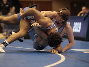 UNC's Chip Ness and Duke's Kaden Russell compete in a match at Cameron Indoor Stadium on Friday, Feb. 22, 2019. UNC won 23-16.