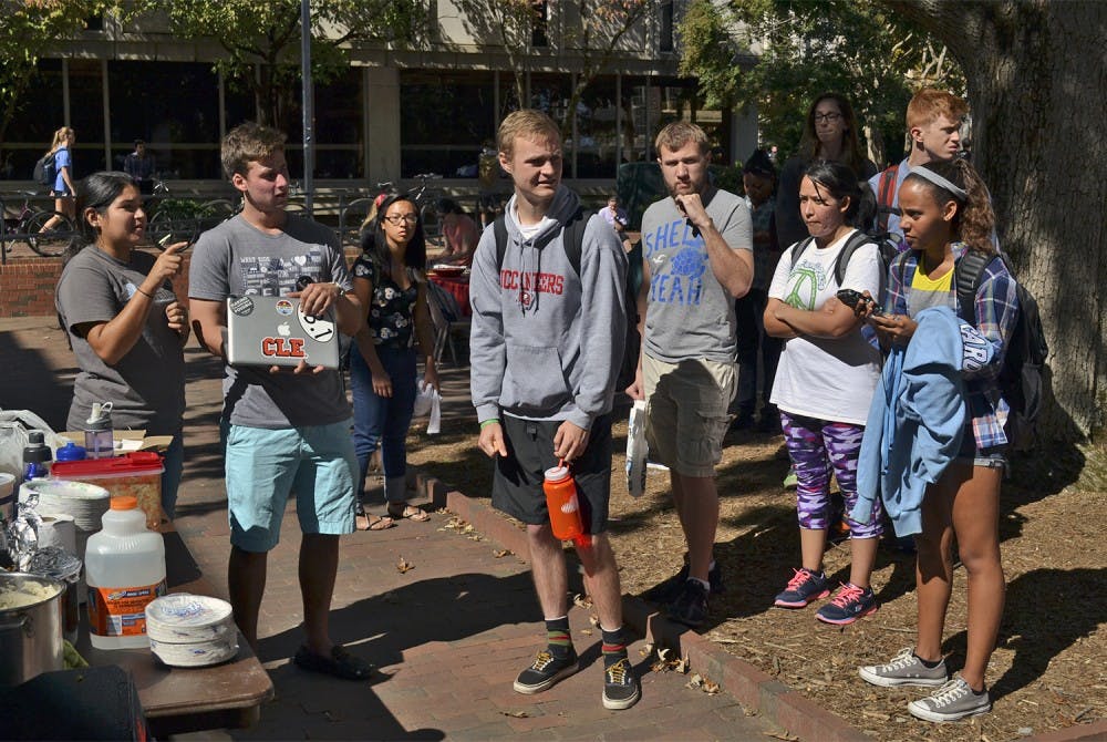 Students wait in line to try free pupusas from local food company "So Good Pupusas", kicking off Hispanic Heritage Month.