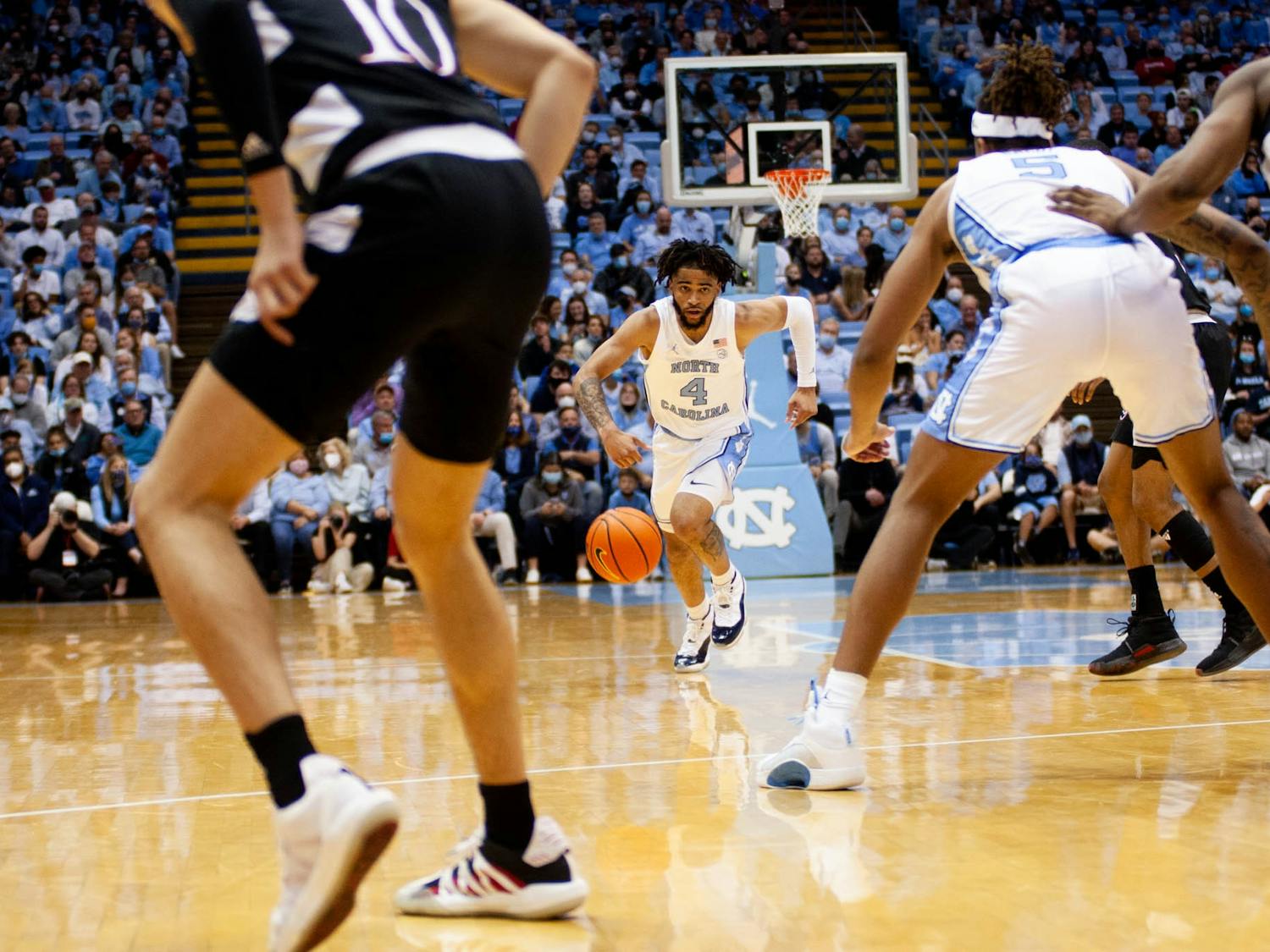 UNC sophomore guard RJ Davis (4) drives the ball up the court during a home men's basketball game against Louisville on Monday, Feb. 21, 2022. UNC won 70-63.