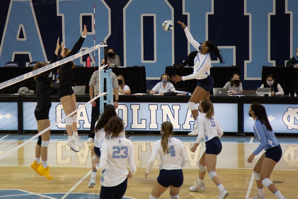 Sophomore middle blocker Skyy Howard (8) prepares to send the ball to the Appalachian State University volleyball team in a game on Thursday, Feb. 18, 2021 in Carmichael Arena. The Tar Heels beat the Mountaineers 3-0.