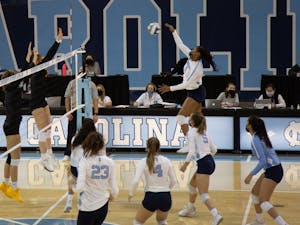 Sophomore middle blocker Skyy Howard (8) prepares to send the ball to the Appalachian State University volleyball team in a game on Thursday, Feb. 18, 2021 in Carmichael Arena. The Tar Heels beat the Mountaineers 3-0.