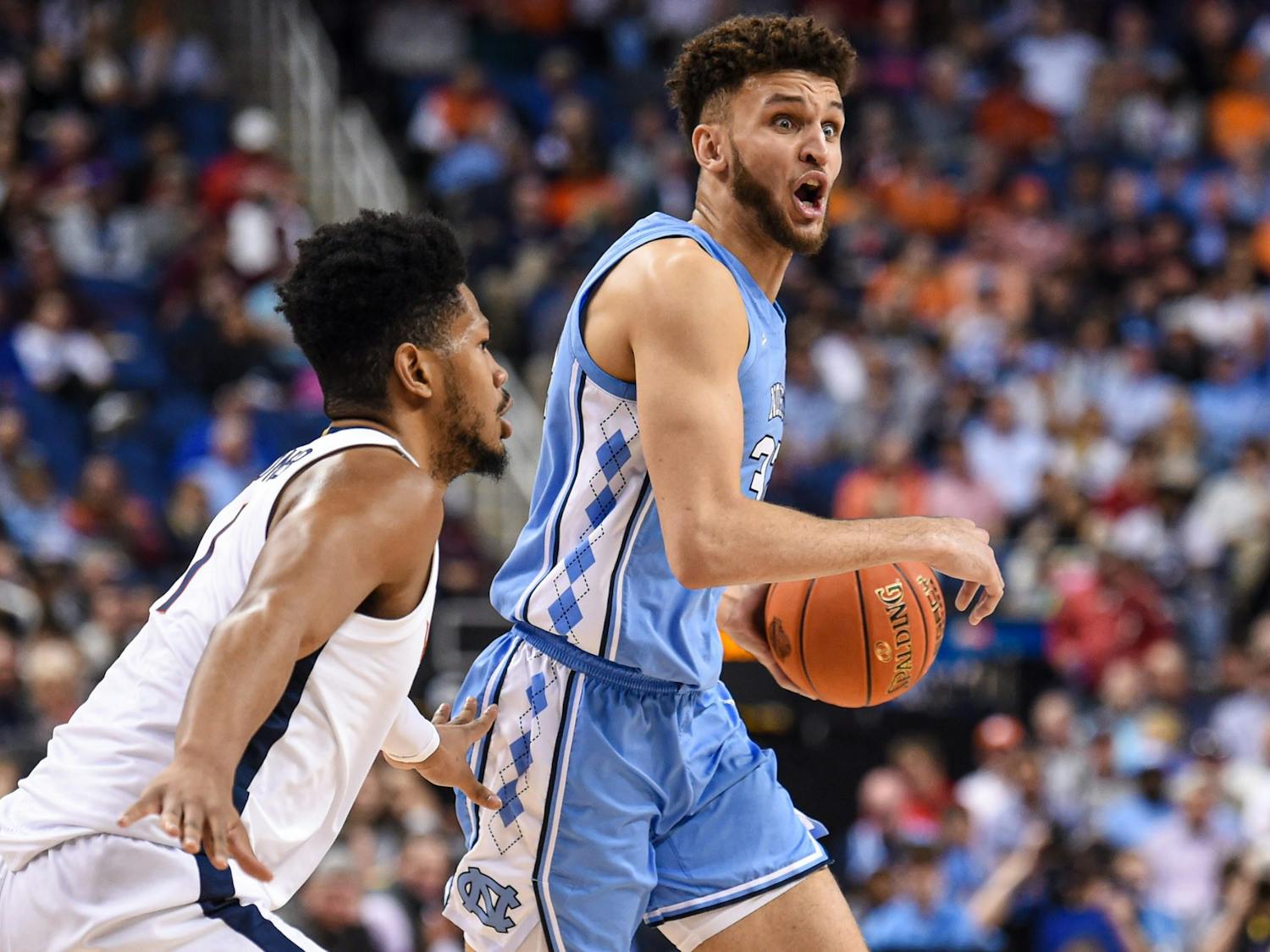 UNC graduate forward Pete Nance (32) directs his teammates during the game against Virginia in the ACC Tournament Quarterfinals at Greensboro Coliseum on March 9, 2023. UNC fell to Virginia 68-59.