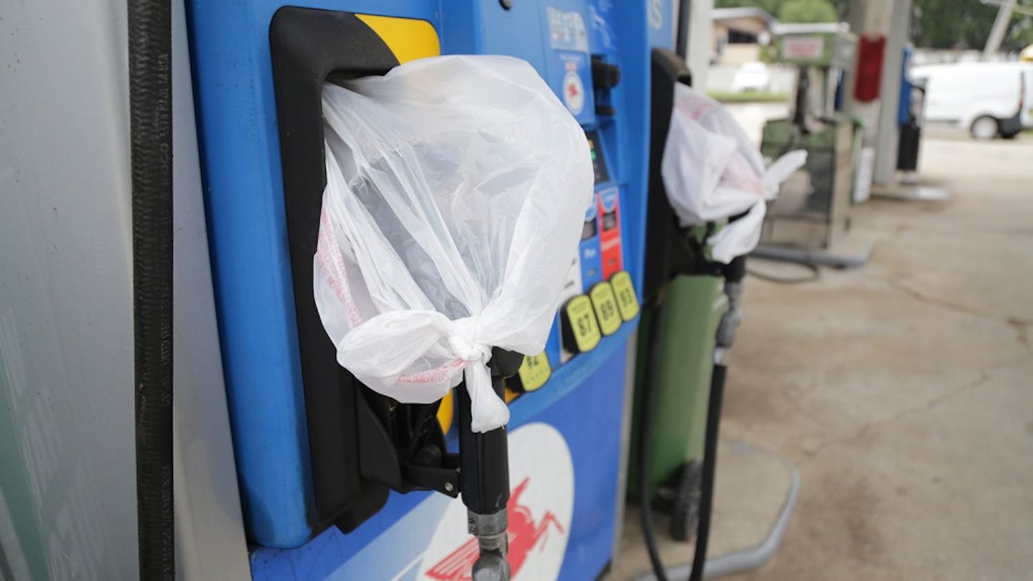 Gas pumps are covered with plastic bags at Run In Jim's gas station on Martin Luther King Jr. Boulevard. This is a common sight at many gas stations in Chapel Hill.  