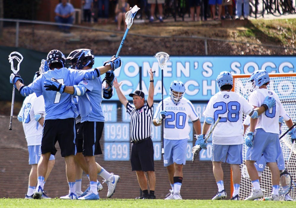 Johns Hopkins' players celebrate a goal during their 13-5 victory over UNC on Saturday, February 25, 2017.