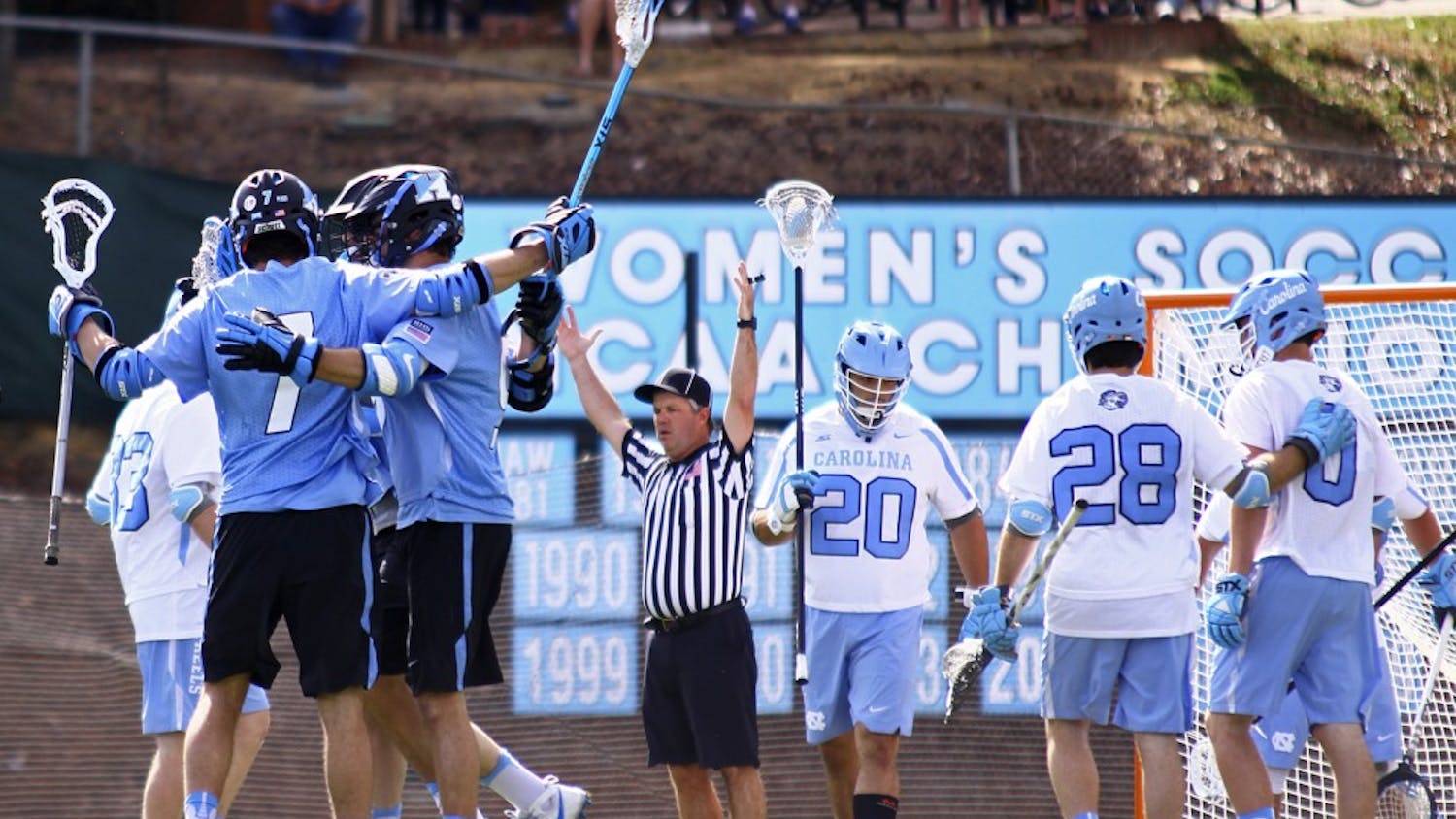 Johns Hopkins' players celebrate a goal during their 13-5 victory over UNC on Saturday, February 25, 2017.
