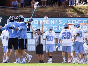 Johns Hopkins' players celebrate a goal during their 13-5 victory over UNC on Saturday, February 25, 2017.
