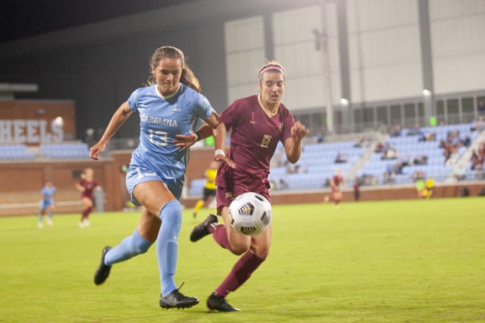 UNC junior forward Isabel Cox fights for the ball against Florida State on Oct. 21. UNC tied with Florida State 2-2.