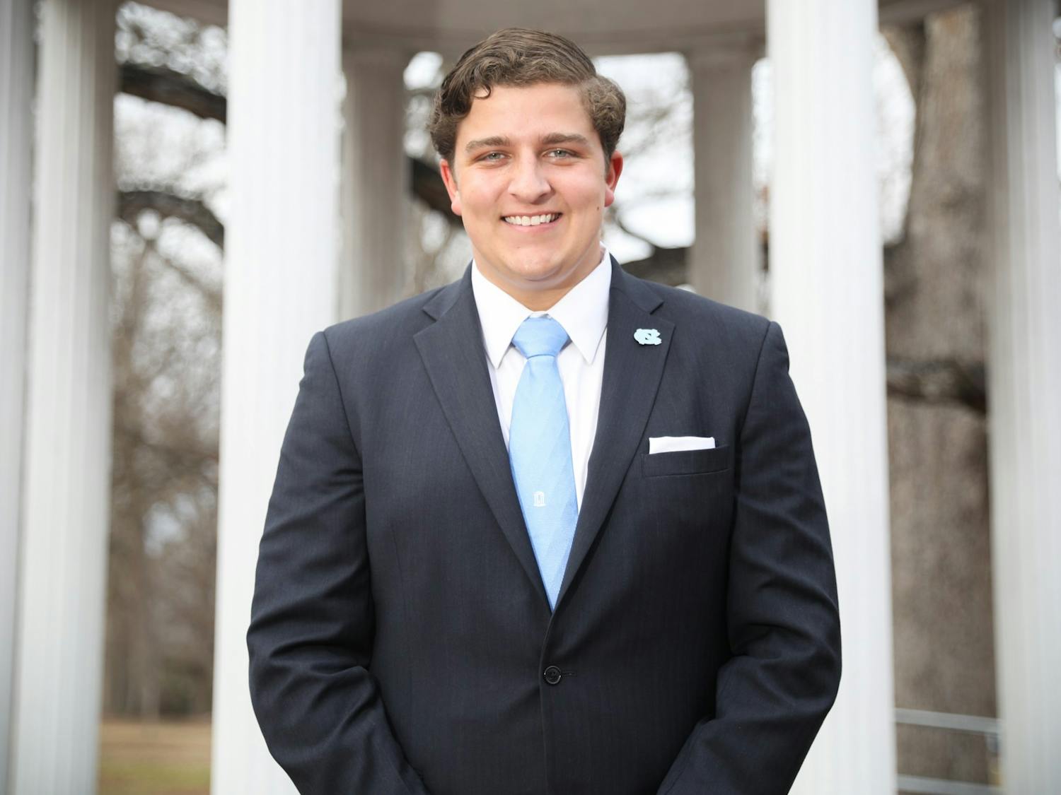 Sam Robinson, a candidate for student body president, stands in front of the Old Well on Thursday, Feb. 3, 2022.  