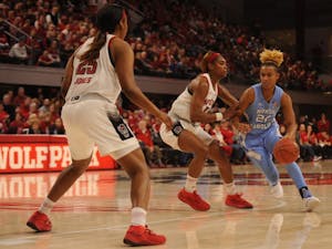 Redshirt senior guard Paris Kea (22) runs down the court during the game against NC State on Sunday, Feb 3, 2019 at Reynolds Coliseum. The UNC women's basketball team beat NC State 64 - 51.