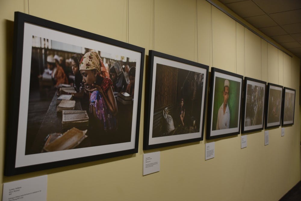 Photos taken by Lynsey Addario in Sittwe, Myanmar are on display in the refugee art exhibit at the Friday Center. 