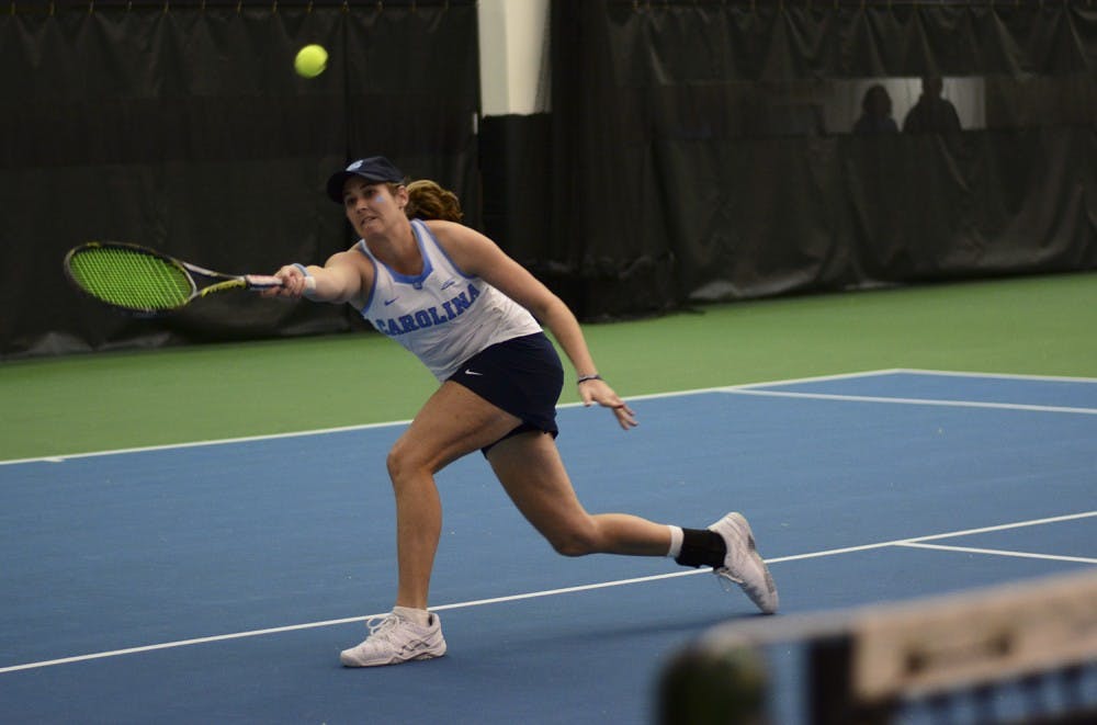 Hayley Carter reaches for a forehand volley in #1 singles at Sunday's Championship Match.