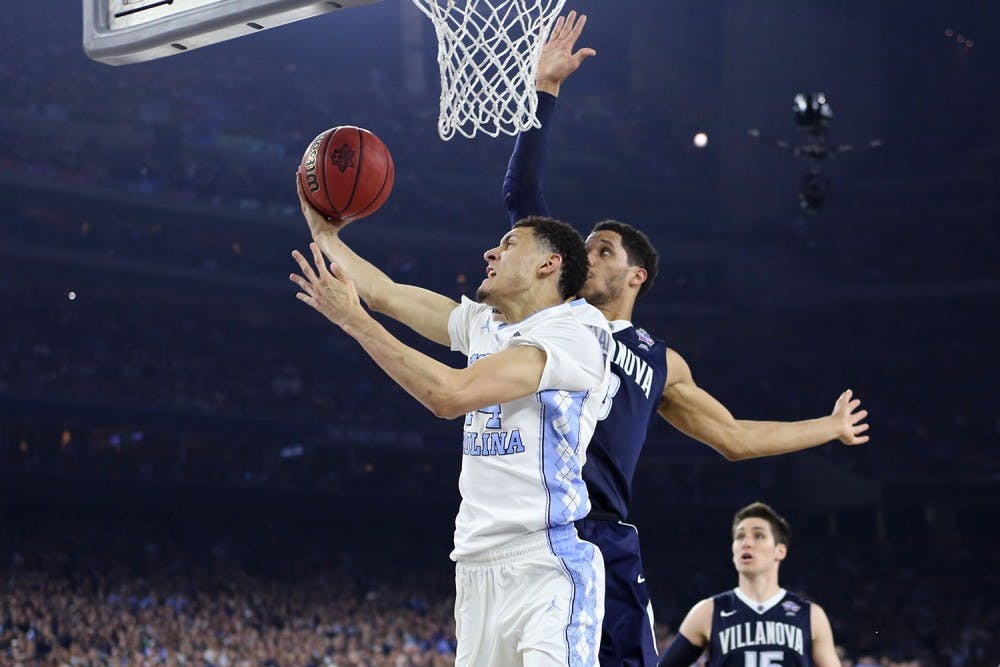 <p>Guard Justin Jackson (44) shoots from underneath the basket.&nbsp;</p>