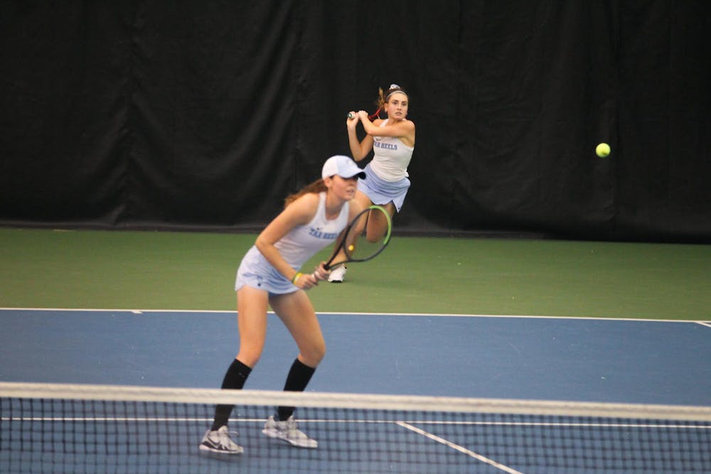 UNC junior Elizabeth Scotty and UNC freshman Lindsay Zink compete in a duos match against UNC Charlotte on at the Cone- Kenfield Tennis Center Indoor Courts oniFriday, Jan. 28, 2022. UNC beat UNC Charlotte 4-0.