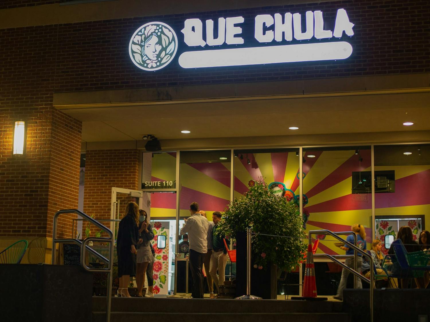 Patrons frequent Que Chula on Franklin Street during a busier time of the night during the week on April 20, 2021.