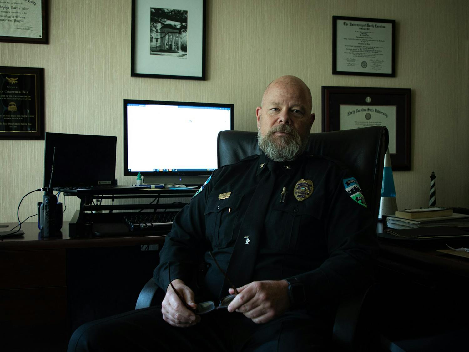 Chapel Hill Police Chief Chris Blue poses for a portrait in his office on Thursday, June 9, 2022. Blue announced this week he will retire at the end of the year.