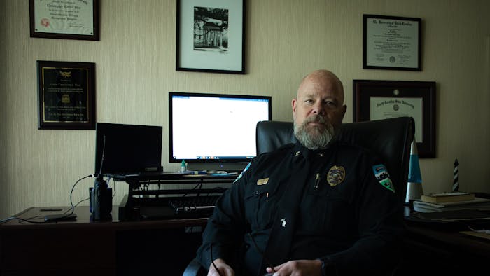 Chapel Hill Police Chief Chris Blue poses for a portrait in his office on Thursday, June 9, 2022. Blue announced this week he will retire at the end of the year.