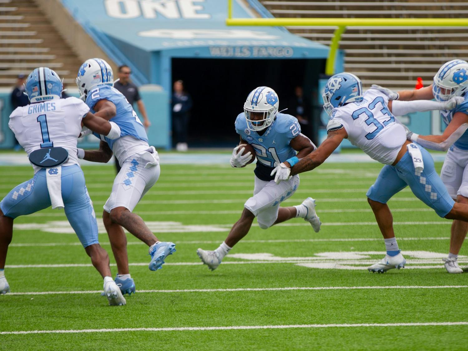 Elijah Green (21), sophomore running back, makes a play during UNC football's spring scrimmage on April 9, 2022, in Chapel Hill, NC.
