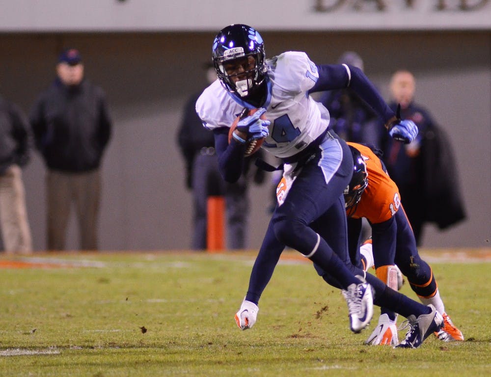 	Quinshad Davis breaks a tackle in the first half vs. UVA.