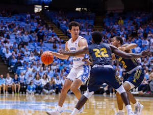UNC junior guard Creighton Lebo (25) defends the ball from his opponents during the exhibition game against JCSU at the Dean Smith Center on Friday, Oct. 28, 2022. UNC beat JCSU 101-40.