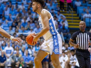 UNC graduate forward Pete Nance (22) prepares to pass the ball to a teammate during the men's basketball game against UNCW on Monday, Nov. 7, 2022 at the Dean Smith Center. UNC beat UNCW 69-56.