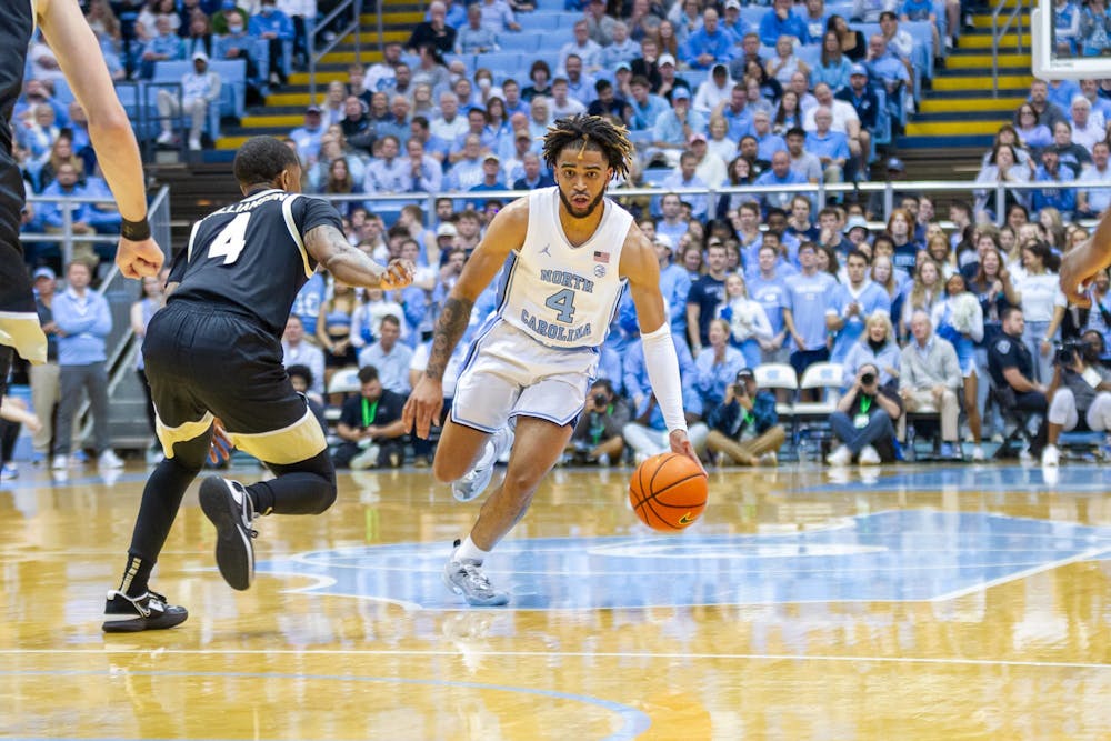 UNC junior guard RJ Davis (4) dribbles the ball down the court during the men's basketball game against Wake Forest at the Dean Smith Center on Wednesday, Jan. 4, 2023.