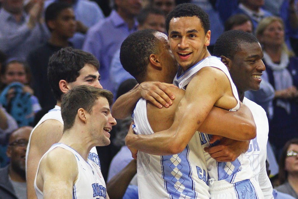 North Carolina seniors Brice Johnson (left) &nbsp;and Marcus Paige (right) embrace after winning a spot into the Final Four by defeating Notre Dame 88-74 at the Wells Fargo Center in Philadelphia.&nbsp;