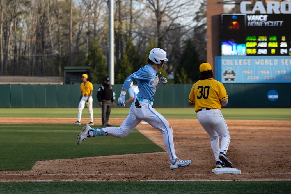 <p>UNC sophomore Vance Honeycutt (7) arrives at first base during the baseball game against North Carolina A&amp;T on Tuesday, March 21, 2023, at Boshamer Stadium. UNC beat North Carolina A&amp;T 6-4.</p>